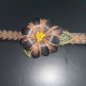 Floral leather snap bracelet.